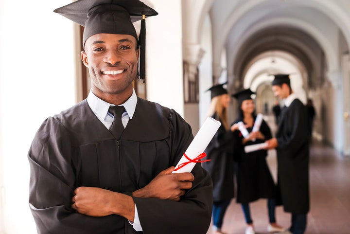 college graduate holding his diploma | Doral Subaru in Doral FL